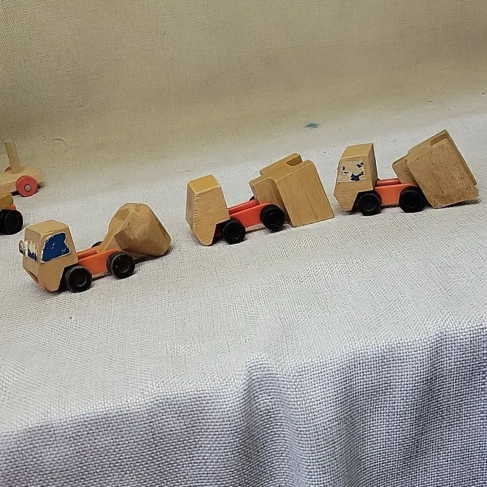 Assorted small wood‎ vehicles..train, dumo truck, race cars...